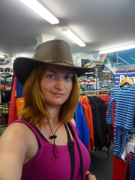 Trying on a hat in Taupo