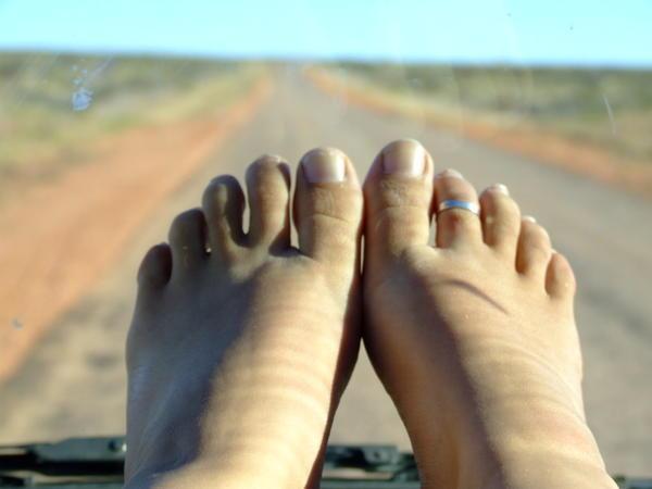 So Lara does her toenails while driving!