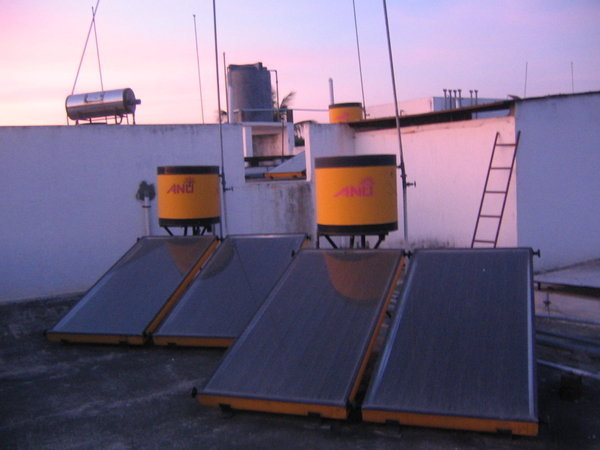 solar water heaters on the roof of the apartment building