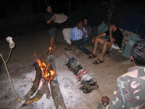 Campfire, attempt to dry dirty wet muddy shoes