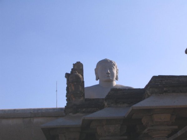 Partial view of giant meditating man statue