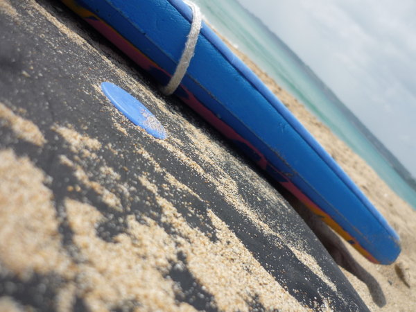 Sand on surfboard