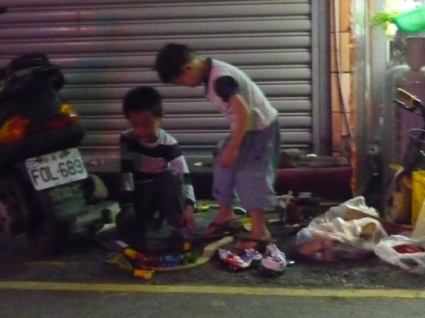 Kids playing next to Mommy's store