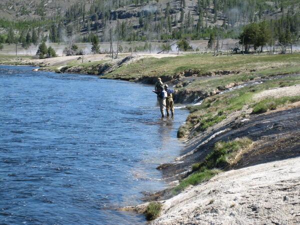 Fly fishing along the Firehole river