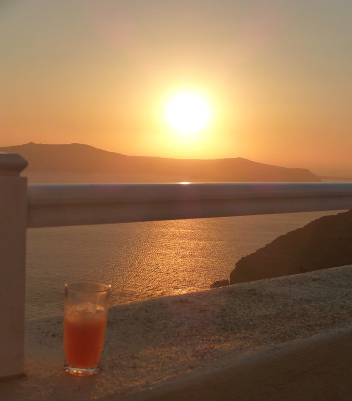 two Santorini sunsets together (mine's an ouzo and pomegranite juice)