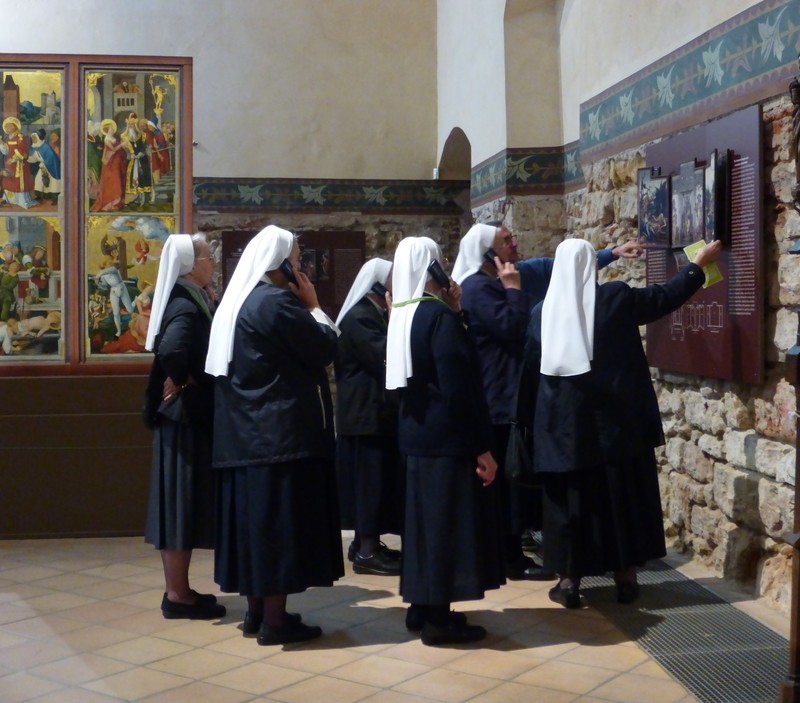 techno nuns plugged into the audio guide at the Colmar museum 