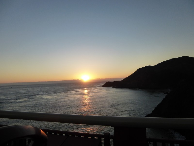 Sunset while driving over the Golden Gate Bridge from the top of the Hop on Hop off bus
