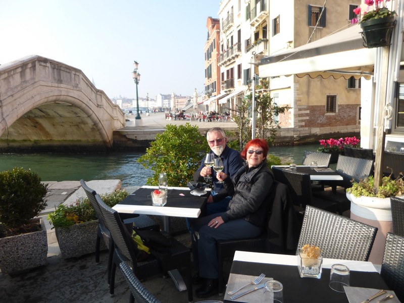 Enjoying a prosecco and a brief patch of sunlight by the Grand Canal 