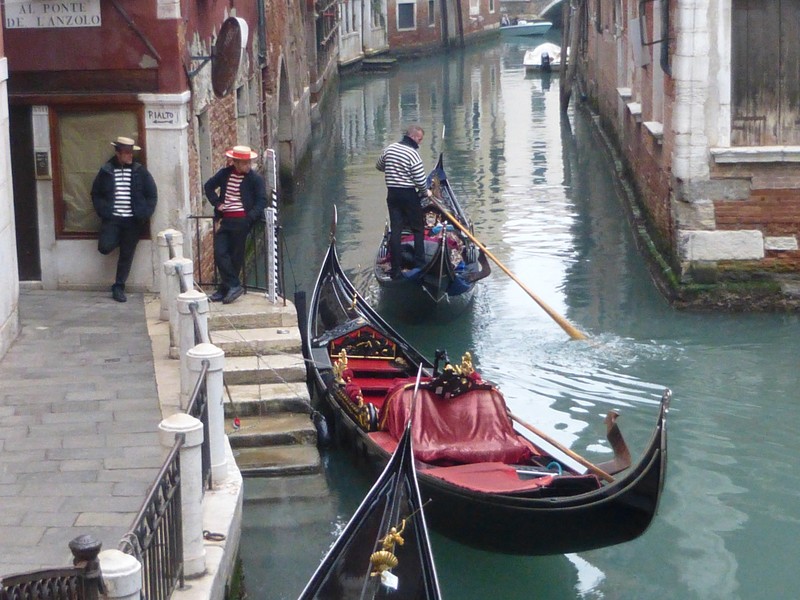 Bored gondoliers waiting for customers