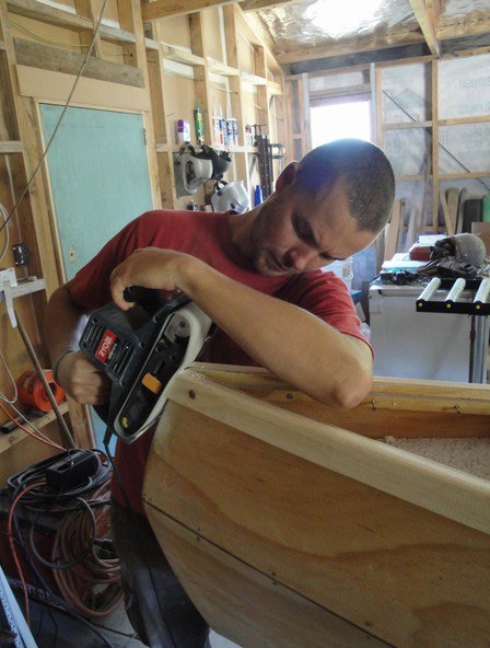 Sanding the gunwales at the bow