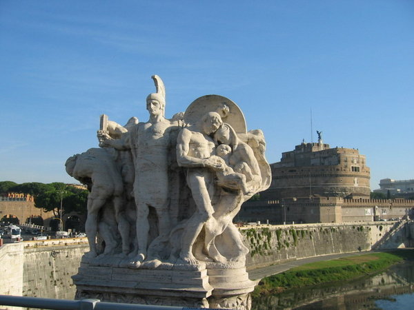 A statue on the bridge crossing the Tiber River