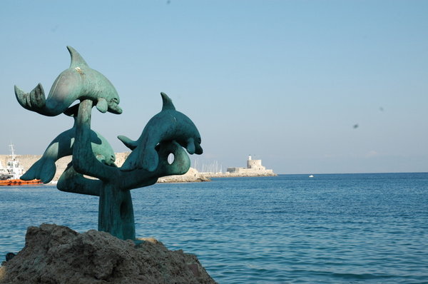 Dolphin statue in the bay