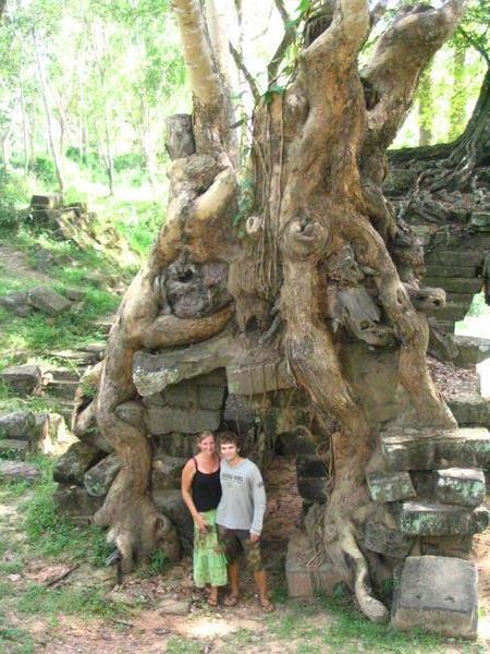 Jimmy and kat under tree that has grown through stone structure