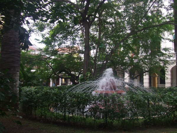 A fountain in a park in old town