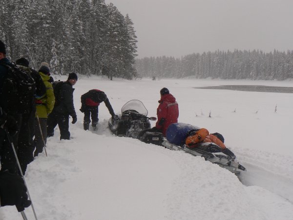 The supply snowmobile gets stuck in deep snow