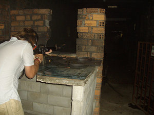 Lee firing an M16 machine gun