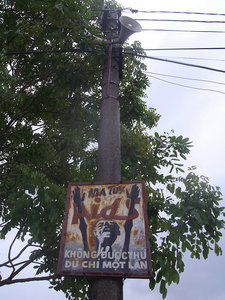 Propoganda poster and loudspeaker in Nimh Binh