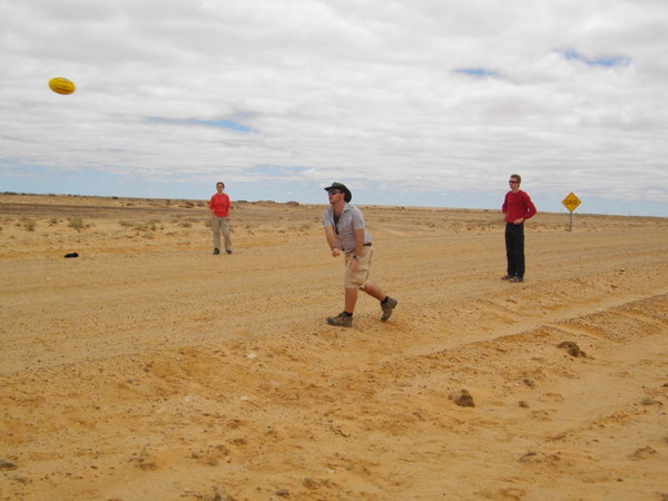 Playing Aussie Rules Footie on an empty road