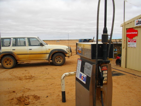 The bustling forecourt of an outback petrol station