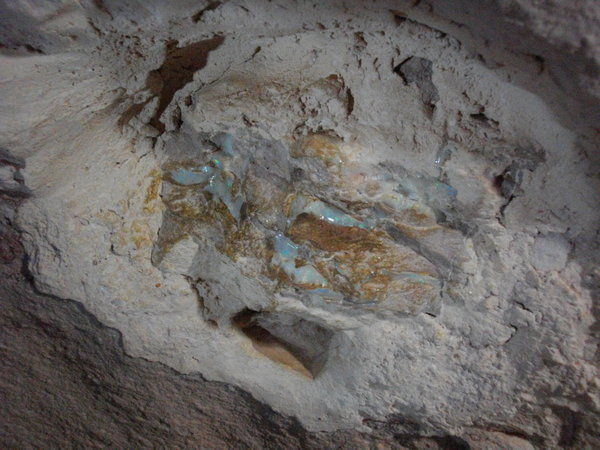 Unmined opal in the walls of the mine