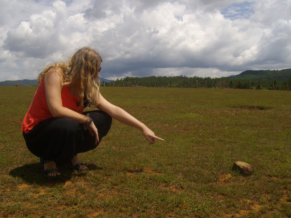 Amy pointing out an unexploded bombie