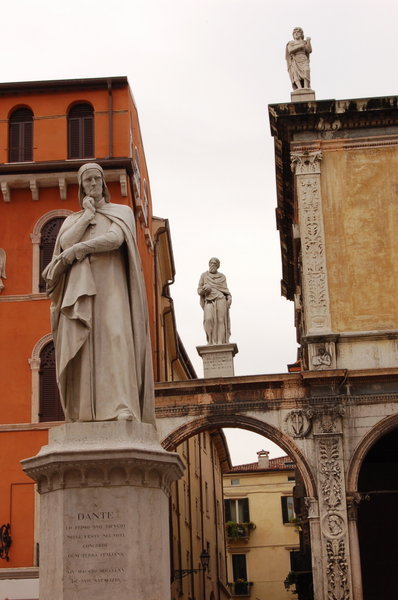Verona Dante watches over the square while his mate waits to drop a globe on the wise