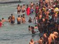 The crowds taking a holy dip