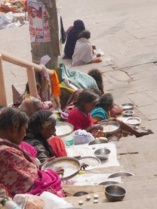The poor begging near one of the ghats