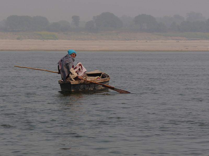 Passing a fisherman tending his nets.