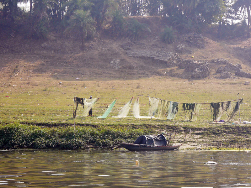 A fisherman drying his nets.