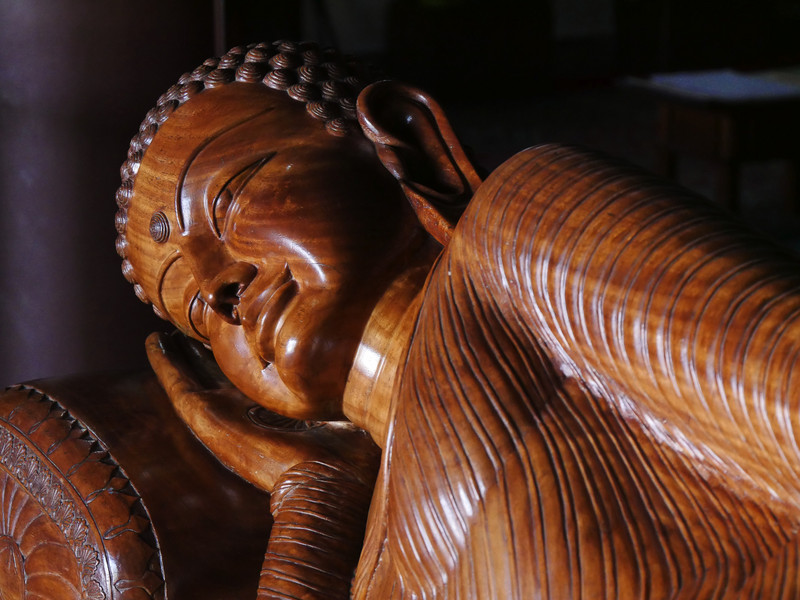 The beautiful sandalwood statue of the sleeping Buddha