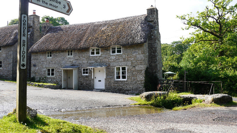 A thatched cottage by a ford at Forder Bridge