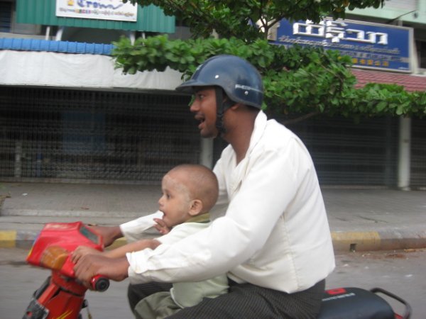 dp FATHER AND CHILD TAKEN FROM AIRPORT MOTO BIKE SHUTTLE MANDALAY,MYANMAR